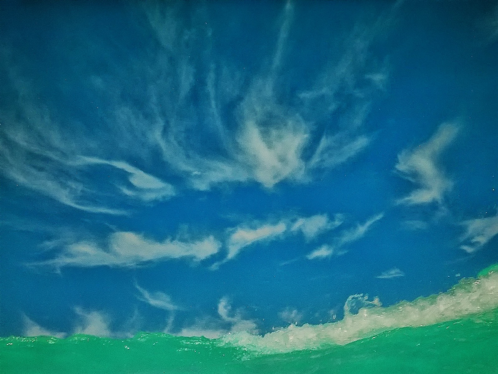 Large tropical waves crushed the shoreline and photographer during its moment of arrival.
