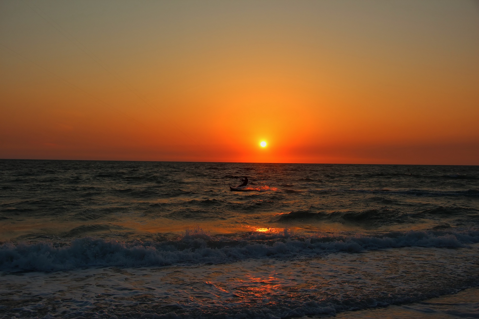 Every twist and turn of the surfboard looked like flames in the water.