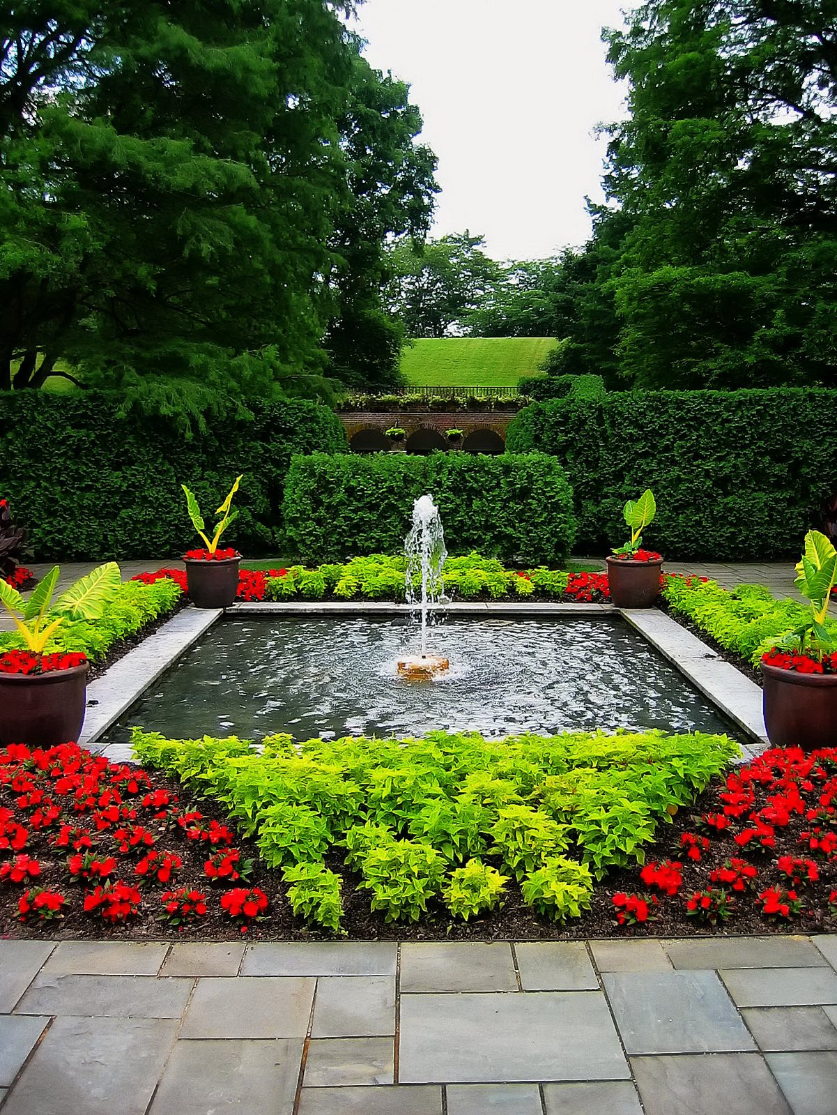 The long view and the promise of more gardens leads the eye and mind to enter.