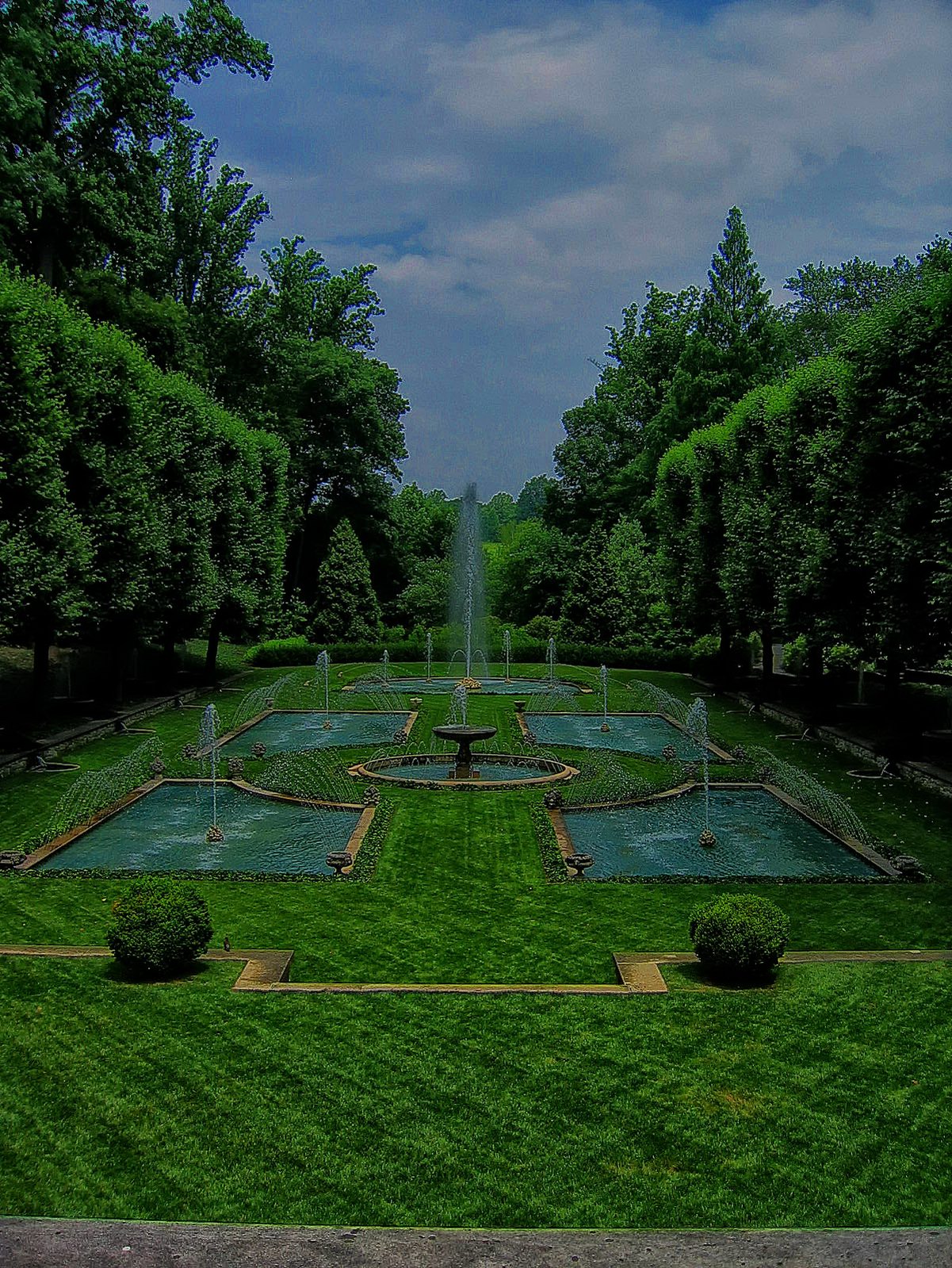 Water softens the formal edges of the Italian garden.