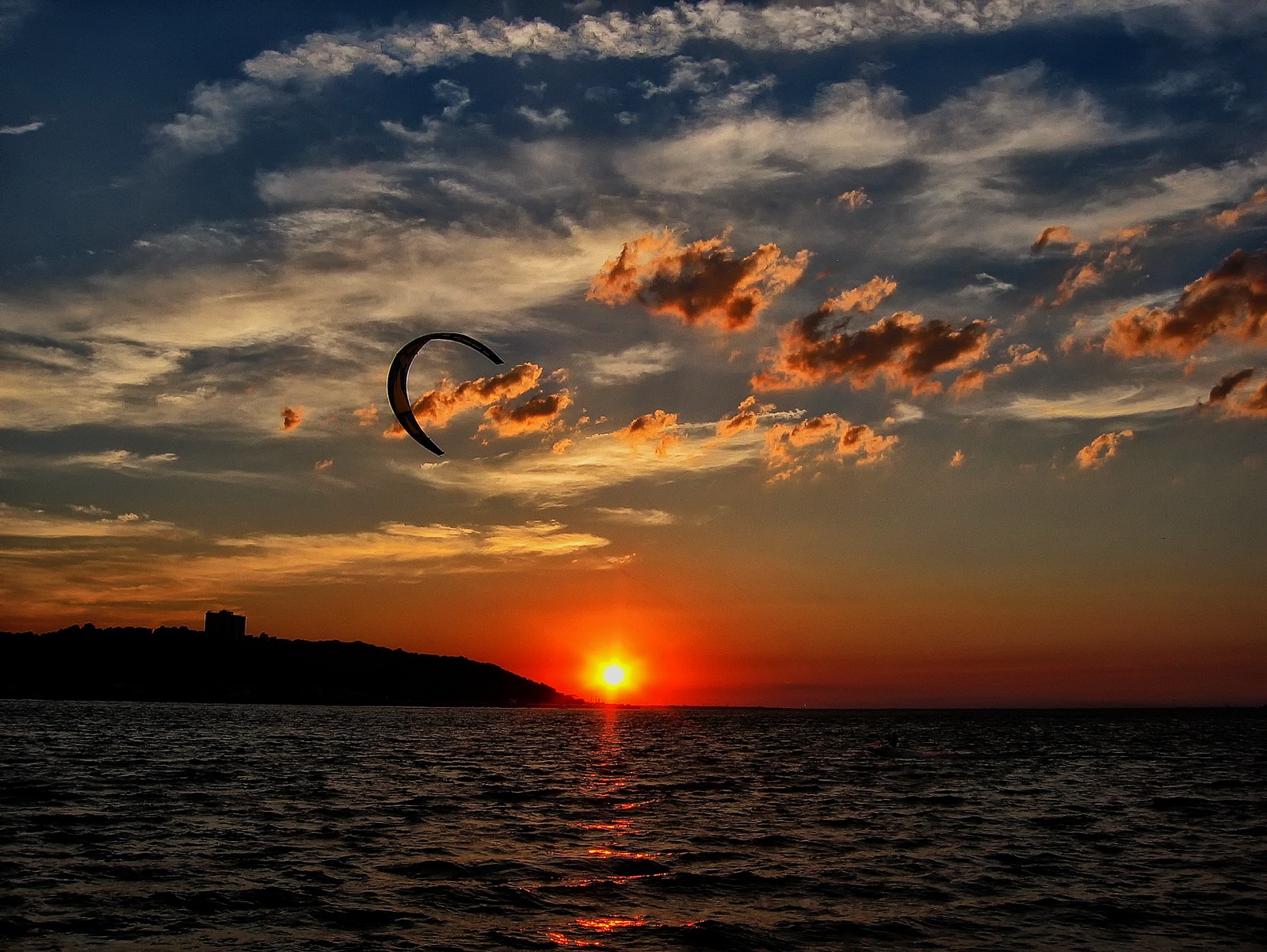 The Kiteboarder used every minute of sun this summer night.