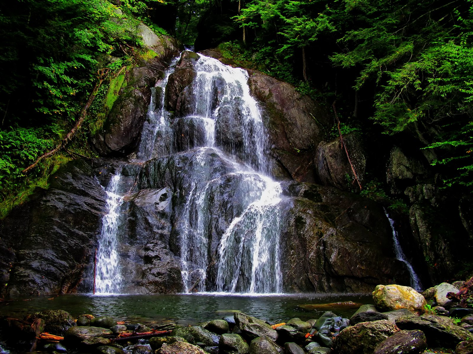 Out of the forest this beautiful waterfall spills into a very inviting pool.